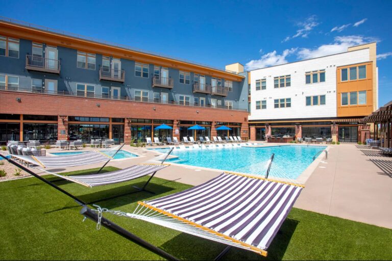 Relax by our resort-style swimming pool at our Lowry Apartments in Denver.